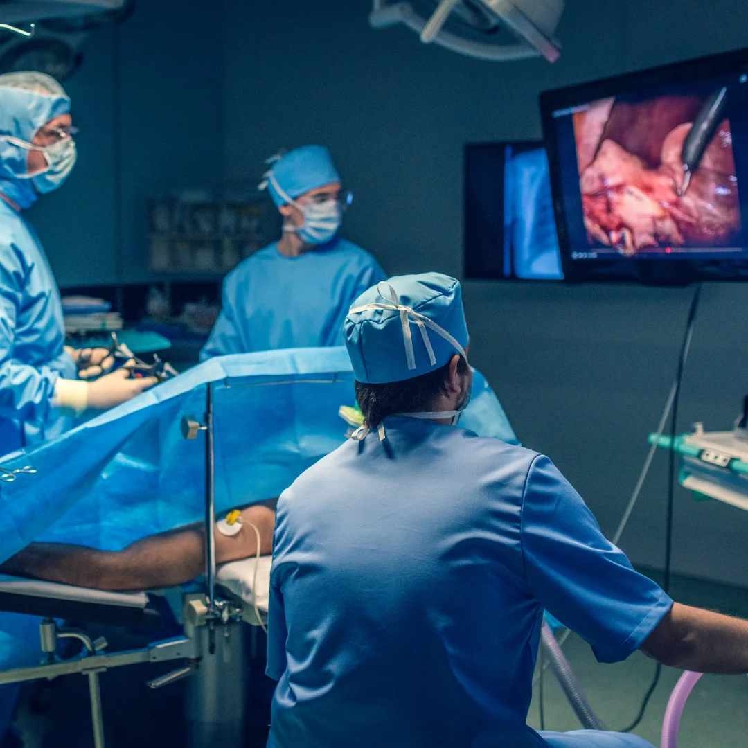 Surgical team performing an operation in an operating theatre.